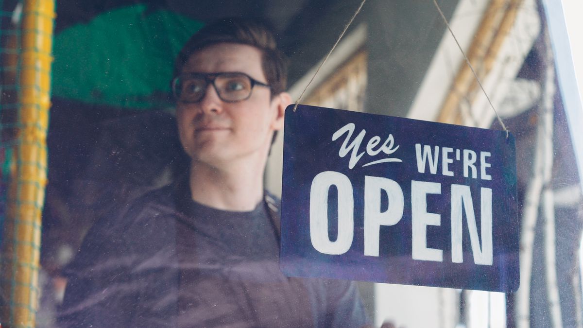 UK small business owner opening their shop